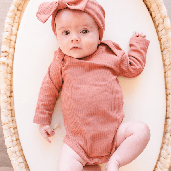 Dusty Rose Organic Ribbed Cotton Bodysuit